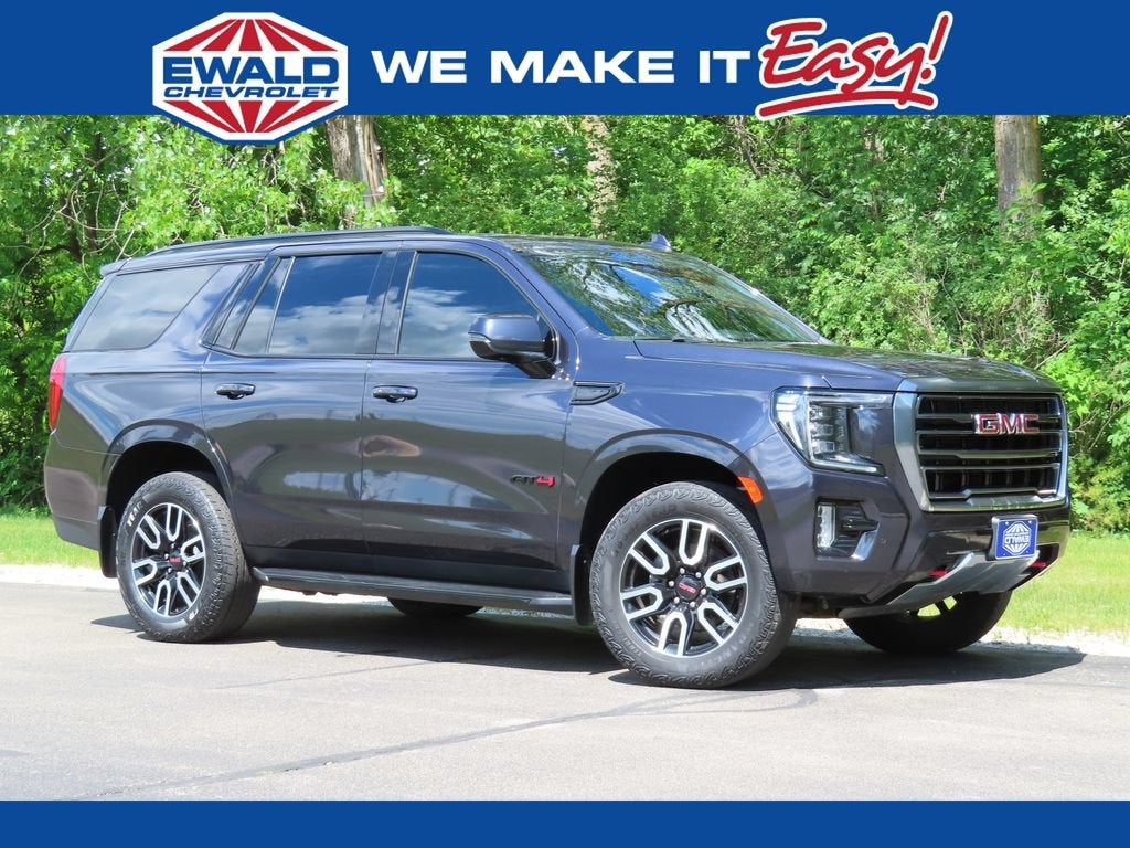 2024 GMC Yukon AT4 in Titanium Rush Metallic — front three-quarter view